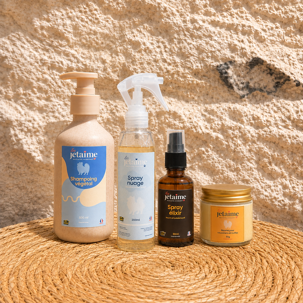 Pack Routine Complète avec quatre soins Les Jetaime sur fond en pierre et fibres naturelles